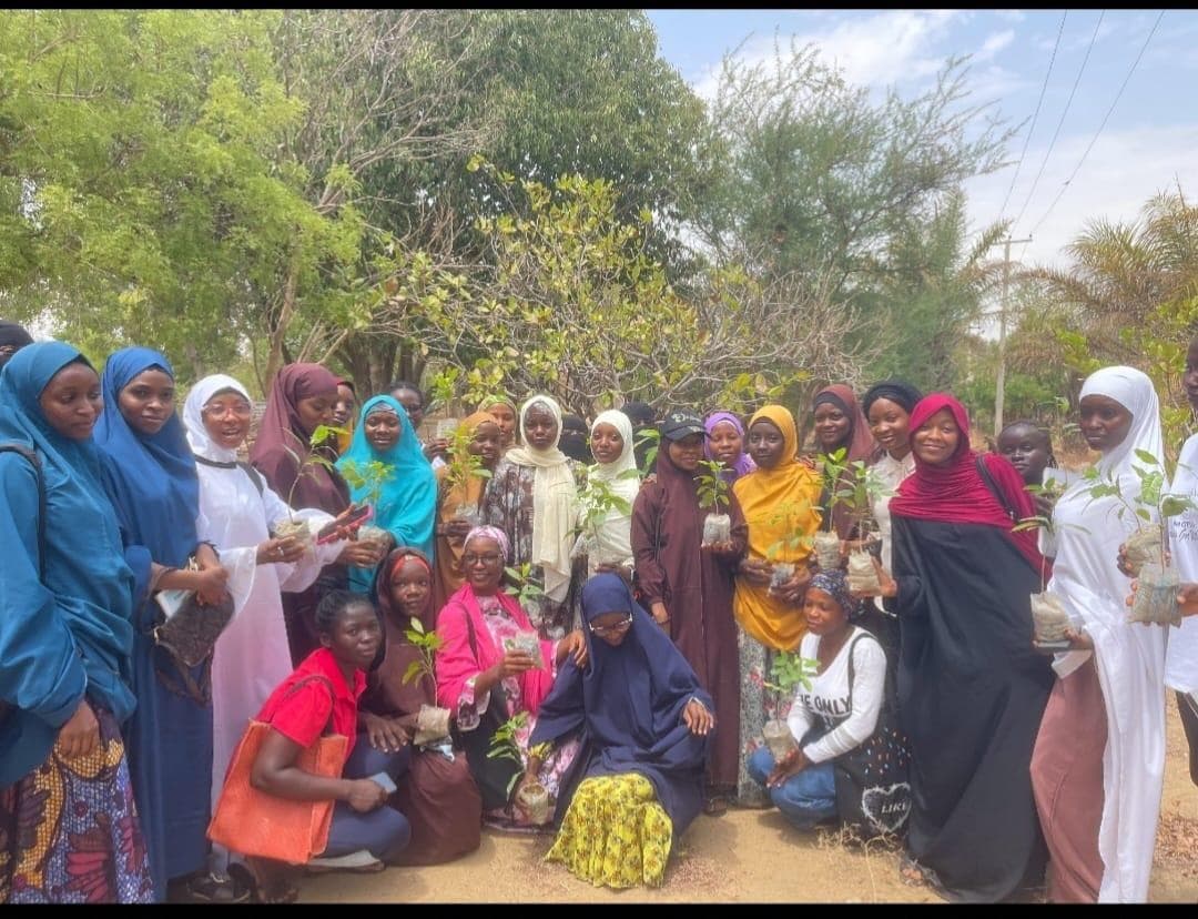 TRF community members gathered with seedlings during community mobilisation